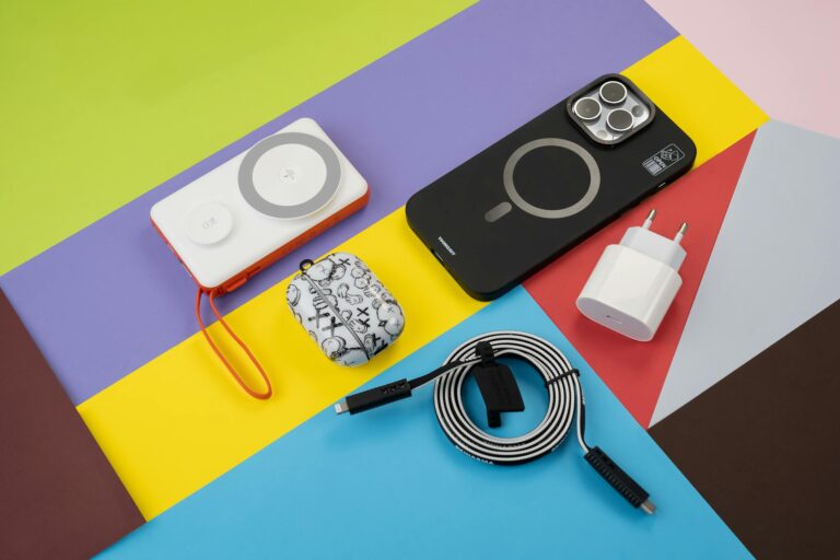 A variety of electronic devices on a colorful background